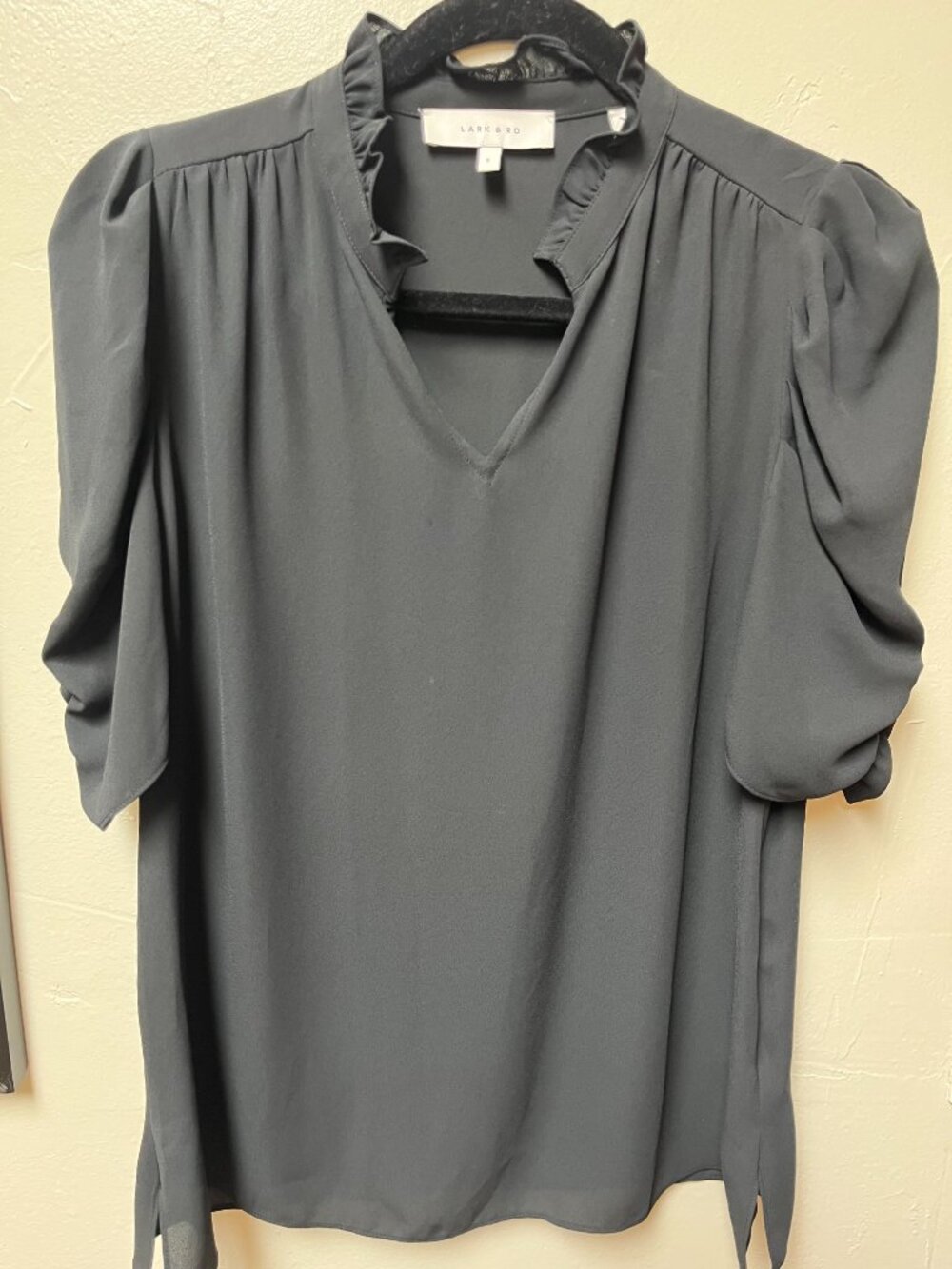 Lark & Ro black short sleeve blouse with ruffled v-neckline